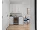 Dining area features a wine cooler, modern bar and a table with upholstered chairs at 226 5Th N Ave # 901, St Petersburg, FL 33701