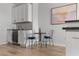 Cozy dining area with a wine fridge, modern lighting, and stylish decor with light wood flooring at 226 5Th N Ave # 901, St Petersburg, FL 33701