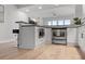 Modern kitchen featuring stainless steel appliances, custom cabinetry, and a functional breakfast bar at 226 5Th N Ave # 901, St Petersburg, FL 33701