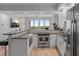 Modern kitchen with stainless steel appliances, custom cabinetry, and a functional breakfast bar at 226 5Th N Ave # 901, St Petersburg, FL 33701