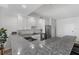 Modern kitchen with stainless steel appliances, breakfast bar, and sleek countertops at 226 5Th N Ave # 901, St Petersburg, FL 33701