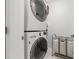 Efficient laundry room features stacked washer and dryer with convenient laundry sorter at 226 5Th N Ave # 901, St Petersburg, FL 33701