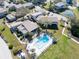Beautiful pool area, surrounded by lush landscaping and comfortable seating at 25 Windrush Bay Dr # 25, Tarpon Springs, FL 34689