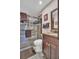 Updated bathroom featuring a glass shower, granite countertop and warm neutral tones at 25 Windrush Bay Dr # 25, Tarpon Springs, FL 34689