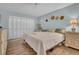 Well-lit bedroom with plantation shutters and neutral tones at 25 Windrush Bay Dr # 25, Tarpon Springs, FL 34689