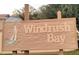 Windrush Bay community sign featuring a sailboat and a nautical theme at 25 Windrush Bay Dr # 25, Tarpon Springs, FL 34689