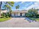 Lovely single-story home with a spacious driveway and inviting curb appeal at 25 Windrush Bay Dr # 25, Tarpon Springs, FL 34689