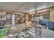 Bright sunroom/lanai with tiled flooring and large windows at 25 Windrush Bay Dr # 25, Tarpon Springs, FL 34689