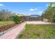 Spacious backyard featuring a patio and a landscaped garden at 27930 Ravens Brook Rd, Wesley Chapel, FL 33544