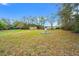 Large backyard featuring a variety of storage sheds at 27930 Ravens Brook Rd, Wesley Chapel, FL 33544