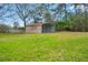 A metal carport on a large grassy lot at 27930 Ravens Brook Rd, Wesley Chapel, FL 33544