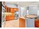 Modern kitchen with wood cabinets, stainless steel appliances, and granite countertops at 27930 Ravens Brook Rd, Wesley Chapel, FL 33544