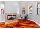 Living room view including a fireplace, wood floors, and table at 27930 Ravens Brook Rd, Wesley Chapel, FL 33544