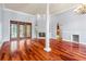 Spacious living room with hardwood floors, fireplace and patio access at 27930 Ravens Brook Rd, Wesley Chapel, FL 33544