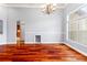 Bright living room with hardwood floors, an elegant chandelier, and large windows at 27930 Ravens Brook Rd, Wesley Chapel, FL 33544