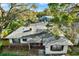 An aerial view of the property showing a well maintained roof with mature trees surrounding the property at 3112 S Julia Cir, Tampa, FL 33629