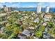 Aerial view of a property near the water with city skyline in the distance at 3112 S Julia Cir, Tampa, FL 33629