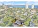Aerial view of a property with a pool and skyline in the background at 3112 S Julia Cir, Tampa, FL 33629