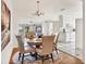 Inviting dining area with chandelier lighting and seamless transition to the adjacent kitchen and living spaces at 3112 S Julia Cir, Tampa, FL 33629