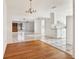 Open-concept kitchen with white cabinetry, modern appliances, and tile flooring flowing into the adjacent living spaces at 3112 S Julia Cir, Tampa, FL 33629