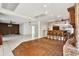 Unique living room with a built-in bar, decorative wall accents, and parquet floors throughout at 3112 S Julia Cir, Tampa, FL 33629