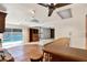 Versatile living room with parquet flooring, built-in bookcase, a bar, and views of the outdoor pool area at 3112 S Julia Cir, Tampa, FL 33629