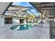 A luxurious pool and spa area with a screened-in enclosure at 3112 S Julia Cir, Tampa, FL 33629