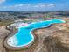 Expansive aerial view of a lagoon and the surrounding area at 31999 Surfton Knot Ct, San Antonio, FL 33576
