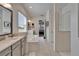 Bathroom with soaking tub, dual vanities, and a separate shower at 31999 Surfton Knot Ct, San Antonio, FL 33576