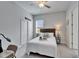 Simple bedroom with light gray walls, a ceiling fan, and neutral decor at 31999 Surfton Knot Ct, San Antonio, FL 33576