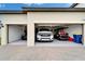Spacious three car garage showcasing ample parking for vehicles and additional storage space at 31999 Surfton Knot Ct, San Antonio, FL 33576