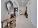 Entry hallway featuring neutral walls, light floors and stylish decorations and lighting at 31999 Surfton Knot Ct, San Antonio, FL 33576