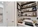 Small home office area with open shelving, desk, and modern accents at 31999 Surfton Knot Ct, San Antonio, FL 33576