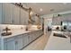 Well-lit kitchen with sleek countertops, stainless steel hood, and modern fixtures at 31999 Surfton Knot Ct, San Antonio, FL 33576