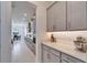 Long kitchen view with sleek countertops, stainless appliances, and plenty of storage at 31999 Surfton Knot Ct, San Antonio, FL 33576