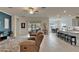 Open-concept living space featuring gray walls, tiled floors and a view to the kitchen at 31999 Surfton Knot Ct, San Antonio, FL 33576