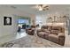 Bright open living room with a large sliding glass door and a view to the backyard patio at 31999 Surfton Knot Ct, San Antonio, FL 33576