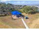 Aerial view of a modern playground with a shaded seating area, ideal for community recreation at 31999 Surfton Knot Ct, San Antonio, FL 33576
