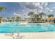 Community pool with shallow water, sun deck, and poolside seating at 31999 Surfton Knot Ct, San Antonio, FL 33576