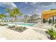Community pool with lounge seating and ample deck space at 31999 Surfton Knot Ct, San Antonio, FL 33576