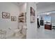 Tastefully decorated powder room featuring a pedestal sink, wall art, and views into an office at 31999 Surfton Knot Ct, San Antonio, FL 33576