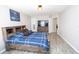 Bedroom featuring a bed, dresser, tv, and laminate floors at 3233 Russett Pl, Land O Lakes, FL 34638