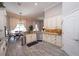 Kitchen with granite counters, stainless steel appliances, and view of the dining area at 3233 Russett Pl, Land O Lakes, FL 34638