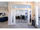 Hall view into a well-lit office space with modern desk setups and stylish rug, perfect for working from home at 3233 Russett Pl, Land O Lakes, FL 34638