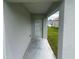 This outdoor entryway has a concrete floor at 35478 Bellington Blvd, Zephyrhills, FL 33541