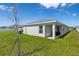 Inviting backyard showcasing a covered patio, ideal for entertaining or enjoying peaceful moments at 35478 Bellington Blvd, Zephyrhills, FL 33541