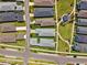 An aerial view showcases a well-maintained community, featuring lush green spaces and neatly arranged homes at 3579 Sweet Mabolo St, Wesley Chapel, FL 33543