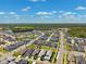 Aerial view of a neighborhood featuring a community pool and water features at 3579 Sweet Mabolo St, Wesley Chapel, FL 33543
