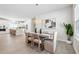 Elegant dining area with stylish table and chairs, complemented by modern lighting and decor at 3579 Sweet Mabolo St, Wesley Chapel, FL 33543