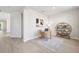 Bright home office with hardwood floors, desk, stylish shelving unit and natural light at 3579 Sweet Mabolo St, Wesley Chapel, FL 33543